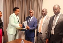UWA 104B Concession Agreement to boost Tourism Ms. Patricia Akakunda of Russell Hall Ltd shaking hands with Prof. Kalema after signing the concession agreement. Right is Minister Martin Mugarra
